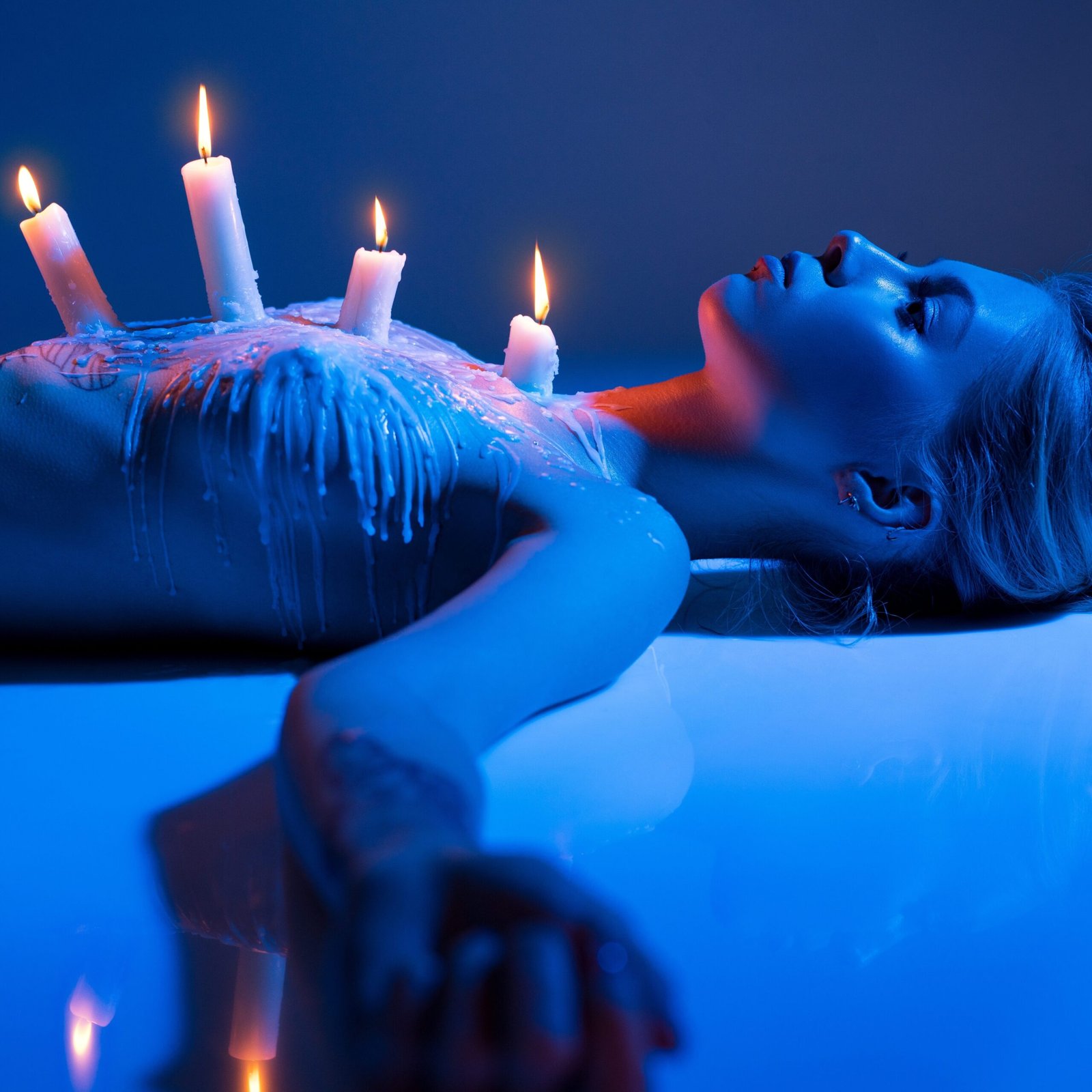 sexy,woman,with,burning,candles,on,body